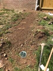 A yard drainage system was installed to direct water away from the foundation walls, helping to prevent soil erosion and future foundation damage.