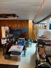 The basement in this West Lafayette home was being used for storage, with outdated paneling, exposed plumbing, and cluttered conditions. The homeowners wanted to turn this space into a clean, finished living area for their daughter, but it first needed a full transformation from the ground up.