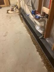 Our crew in the process of installing WaterGuard and SuperSump+