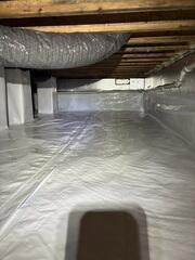 After the upgrade: CleanSpace, SilverGlo insulation, and the SaniDry Sedona work together to keep this crawl space dry, energy-efficient, and protected.