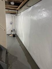 CleanSpace was added along the basement walls to seal out moisture, brighten the space, and prevent mold growth.