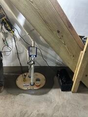 Our team installed the TripleSafe Sump Pump neatly under the stairs for powerful, unobtrusive protection.