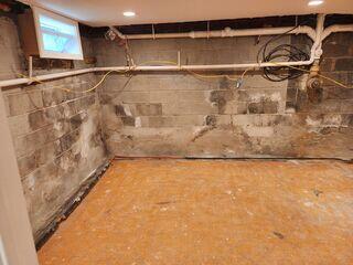 This Ringwood, NJ basement was once fully finished, but repeated flooding forced the homeowner to tear out drywall and flooring.