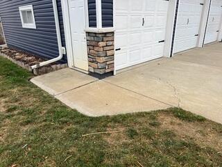 A closer angle at the driveway and walkway to the garage