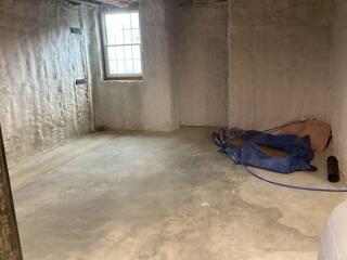 Damp basement walls and a musty smell were clear signs that water intrusion was becoming a problem for this Princeton home.