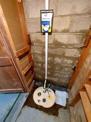 During: Our Foreman, Kevin, and his crew replaced the irregular running sump pump with the TripleSafe sump pump.