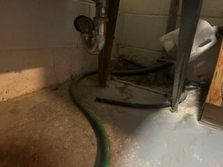 Before: Jason, one of our Design Specialists, confirmed the basement was suffering from water intrusion.