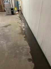 The crew installed WaterGuard along the edges and restored the flooring with cement