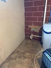 Before: signs of water intrusions can be seen along the edges of the floor