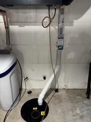 During: Our Foreman, Dakota, and his crew installed a part of the Radon Mitigation System on the interior.