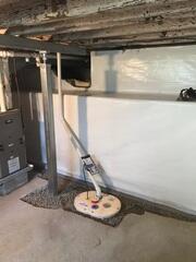 During: Dylan, one of our Design Specialists, recommended installing several waterproofing products throughout the basement.