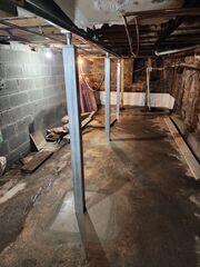 SmartJacks were installed to stabilize and level uneven floors caused by foundation settlement, providing strong, adjustable steel supports that restore structural integrity and prevent further damage.
