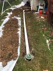 Exterior drainage systems installed for sump pump water removal