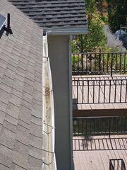 leaves and buildup caused bent gutters