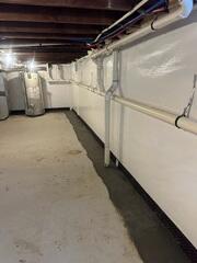 With CleanSpace wall liner and the WaterGuard drainage system installed, the basement is now clean, bright, and fully protected against water seepage.