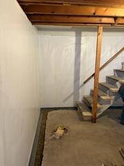 During: The crew attached CleanSpace to the walls and are in the process of installing WaterGuard