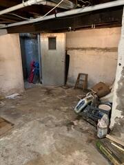 Mold forming on the damp basement walls in Fair Lawn, NJ before waterproofing.