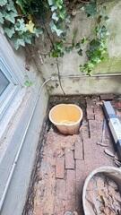 Our crew installed the TrenchDrain System at the garage entrance to capture surface water, then connected it to our TripleSafe Sump Pump, which was placed in a nearby pit to efficiently pump collected water away from the home.