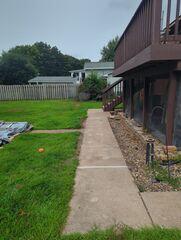 During: Our Foreman, Troy, and his crew lifted the sidewalk back to its original level.