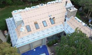 The four skylights on the front slope were upgraded with brand-new Velux skylights. This was part of a full roof replacement, where we installed the complete Klaus Larsen Roofing System. First, SealoronXT Deck Tape was applied between the plywood seams, then VeloraONE Roof Underlayment was rolled out across the roof for extra leak protection, and SealoronXT Ice & Water was placed in all the most vulnerable areas.