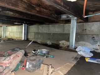 During: Our Foreman, Kingsley, and his crew secured the SmartJacks and PowerBraces throughout the crawl space.