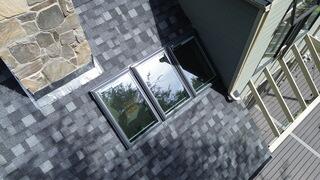 What a difference! Instead of a crowded bundle of eight, the home now has three skylights that look clean and modern. We added small gutter systems between them so leaves can slide through without causing clogs or leaks.