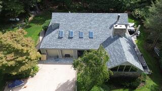 The finished roof from above, complete with IKO Dynasty shingles in Frostone Grey. The home now has a sharp, refreshed look and, most importantly, long-lasting protection. The Klaus Roofing Way!