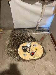 During: Our Foreman, Kingsley, and his crew worked hard to secure all the waterproofing products throughout the basement.