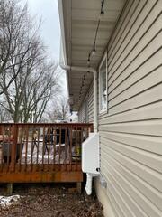 During: Our Foreman, Dakota, secured the Radon Mitigation System outside the home.