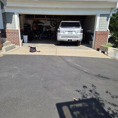 Before: A look of the slabs sinking in front of the garage