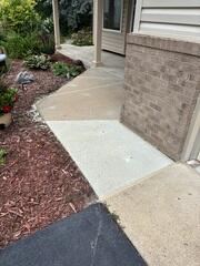 After: Our crew lifted the slabs, filling in the voids in the soil and sealed the joints