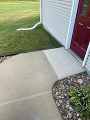 After: Our Foreman, Ryan, and his crew successfully lifted and leveled the sidewalk back into place.