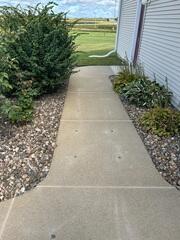 During: Our Design Specialist, Ryan, traveled to the home to take a closer look at the sunken sidewalk.