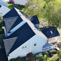 Completed roof replacement in Newark, Delaware showcasing the Klaus Roofing System with IKO Dynasty Granite Black shingles, built to eliminate leaks and protect against future roof problems.