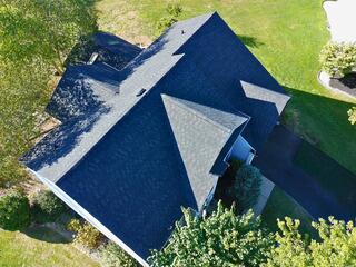 Completed roof replacement in Newark, Delaware showcasing the Klaus Roofing System with IKO Dynasty Granite Black shingles, built to eliminate leaks and protect against future roof problems
