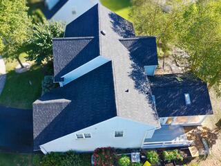 Close-up view of IKO Dynasty shingles in Granite Black on a Klaus Roofing System in Newark, DE, highlighting superior leak protection and high-performance roofing materials