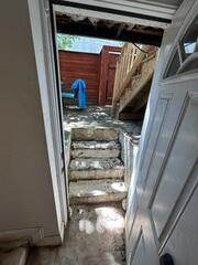 Steps into the basement where water intrusion became a problem.