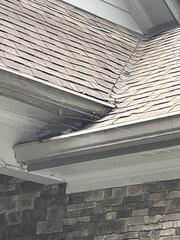 Before: This area was a major concern for him as the water was pouring directly down by his front door.  Fearful of foundation issues he called Gutter Shutter of Greater for help.