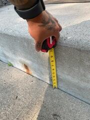 A close up to see how far the slabs have sunken from the step