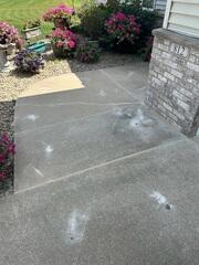 The slabs along the walkway were lifted and the joints and crack were sealed