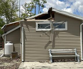Damaged Pool Room: This photo was taken upon initial inspection. Wind damage caused this.