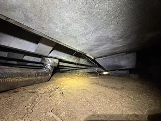The dirt in this space was reaching the crawl space ceiling.