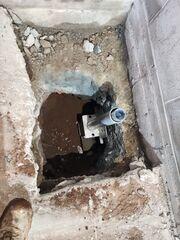 With the piers securely in place, we used hydraulic equipment to gently transfer the weight of the structure onto the piers, effectively lifting and stabilizing the garage foundation to prevent any future settlement.
