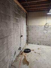 Before the space is waterproofed. Efflorescence and water stains can be seen