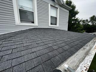This photo was also taken upon the initial inspection and it shows a close up of the shingles, as well as the deteriorating box gutters.