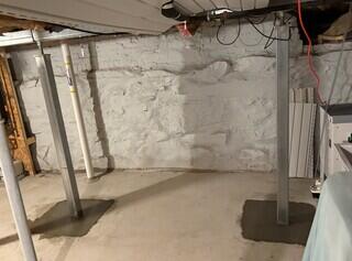Four SmartJacks were installed throughout the basement to provide reliable support. They're made of galvanized steel and can be adjusted to reverse the sloping that has already occurred in the floors of the home above over time.