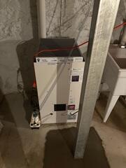 The SaniDry XP dehumidifier keeps the humidity in the air of the basement low and conveniently drains itself.