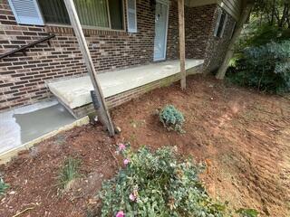 The porch slab re-leveled and stabilized with PolyLYFT™, restoring a safe and clean entryway.