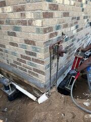 During: Our Design Specialist, Derek, recommended securing Helical Piers along the struggling walls.