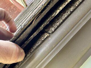 The existing roofing system had two layers of shingles, which were worn out and trapping moisture beneath them. This photo was also taken upon the initial inspection.